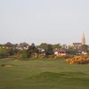 A view of the 5th green from Nairn Dunbar Golf Club with the clubhouse in the background