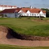 A view of the 18th green from the Kintyre course at Turnberry Resort with the clubhouse in background.