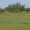 A view of green guarded by bunkers at Irvine Ravenspark Golf Course