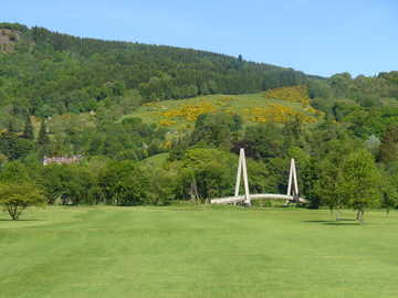 The famous walking bridge seen behind Aberfeldy GC's 5th green (Photo by K. Christianson)