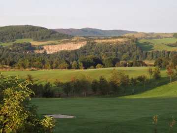 Dalbeattie GC: Sunrise at the 6th green with the quarry in the background (D. McDonald)
