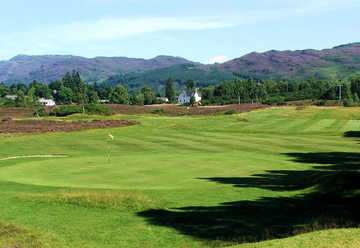 Fort Augustus GC: A picture of the 5th green from the 6th tees looking back towards the clubhouse (Davy Mackay)